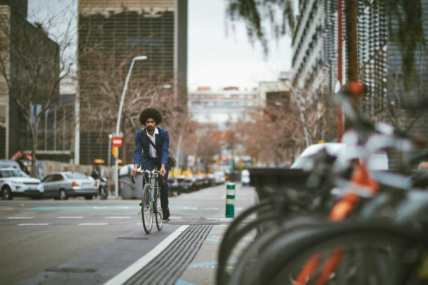 istock Mid Adult Male Commuter Cycling Home from Work 1220975330