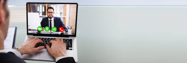 istock Cropped Image Of Businessman Using Laptop At Desk 1220975470