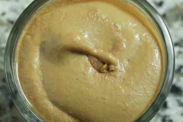 istock close up on yellow mustard sauce detail 1220976661