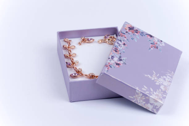 istock Beautiful necklace with earrings in a purple gift box 1220977687