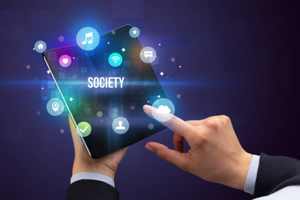 istock Businessman holding a foldable smartphone 1220978400