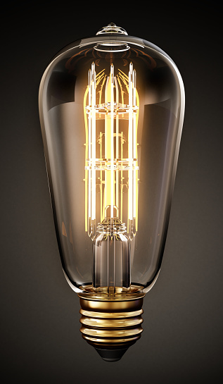 Decorative vintage LED lightbulb isolated on black.