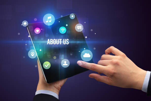istock Businessman holding a foldable smartphone 1220978578