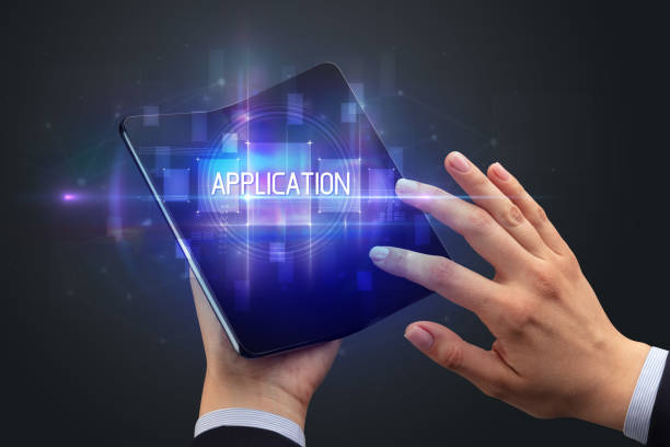 istock Businessman holding a foldable smartphone 1220978610