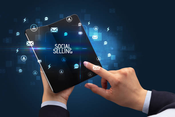 istock Businessman holding a foldable smartphone, social media concept 1220978905