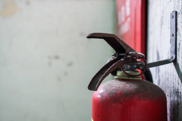 istock Fire extinguisher hanging on the wall in public places. 1220979580