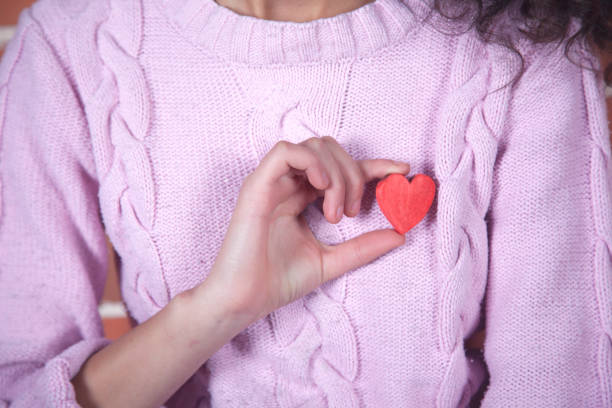 istock woman hand red heart 1220979745