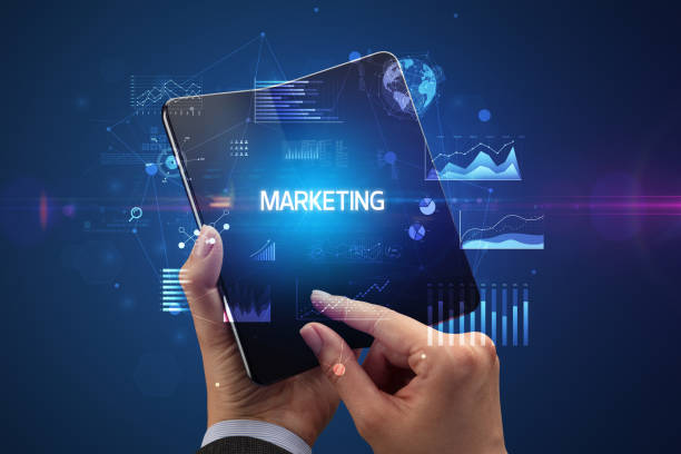 istock Businessman holding a foldable smartphone, business concept 1220979811