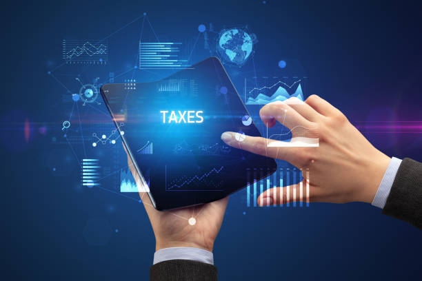 istock Businessman holding a foldable smartphone, business concept 1220980852
