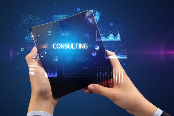 istock Businessman holding a foldable smartphone, business concept 1220981065