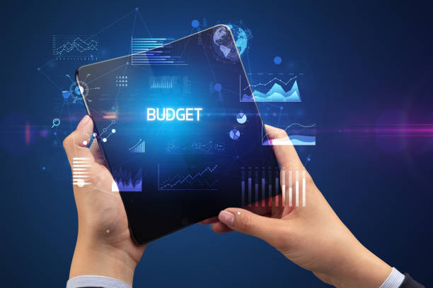 istock Businessman holding a foldable smartphone, business concept 1220981576