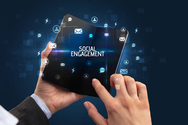 istock Businessman holding a foldable smartphone, social media concept 1220981601