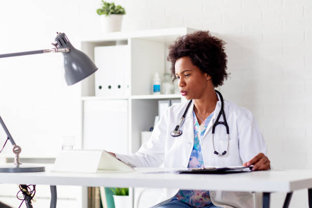 istock Doctor woman llooking at analyse document in ambulance office 1220981699