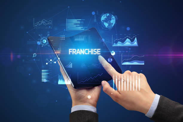 istock Businessman holding a foldable smartphone, business concept 1220981873