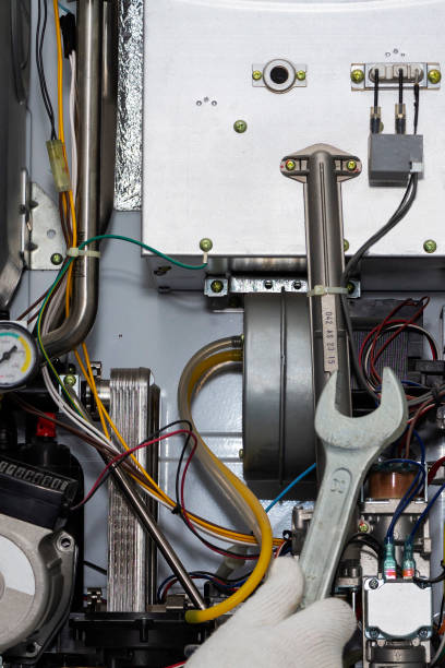 istock gas boiler repair service, preparation for heating. 1220981954