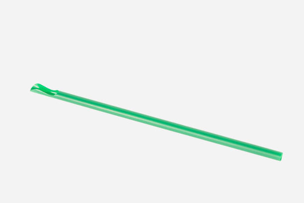 istock Green drinking straw isolated on white background. 1220983635