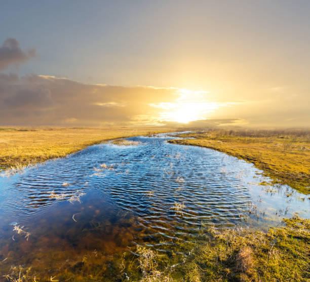 istock small blue lake in a prairie at the sunset 1220984557