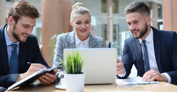 istock Group of business partners discussing ideas and planning work in office. 1220985761