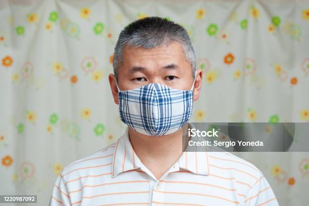 Front View Of Middle Aged Asian Man Wearing Stock Photo - Download Image Now