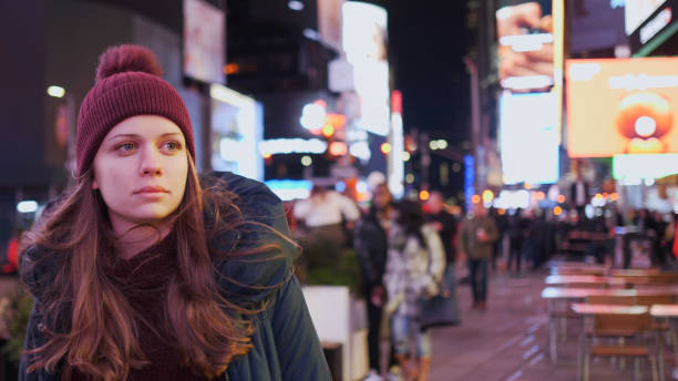 istock Walking on Times Square New York by night while doing a sightseeing trip to Manhattan 1220987275