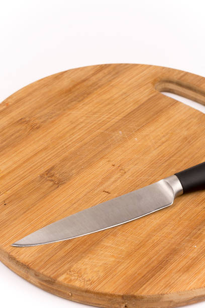 istock Knife on the kitchen wooden board 1220987485