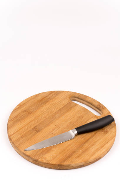 istock Knife on the wooden cuting board 1220987509