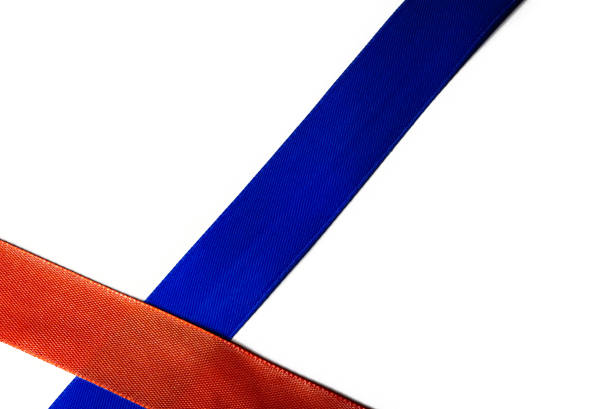 istock two ribbons red and blue background 1220987722