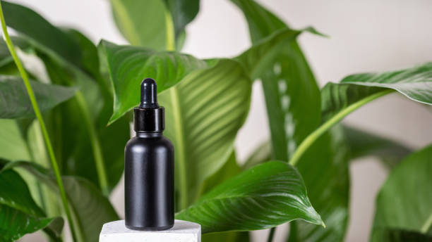 istock Serum oil in bottle with pipette and natural cosmetics component 1220990348