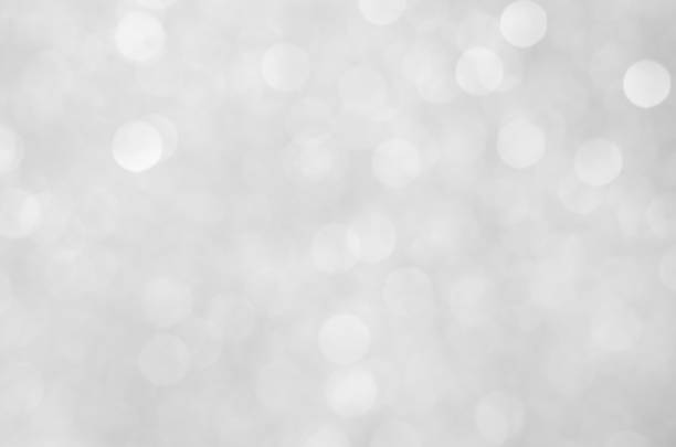 istock abstract white blur bokeh glitter sparkle no color background. 1220992165