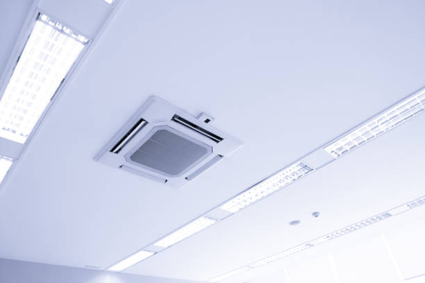 istock White ceiling mounted cassette type air conditioner for large rooms, exhibition room 1220992538