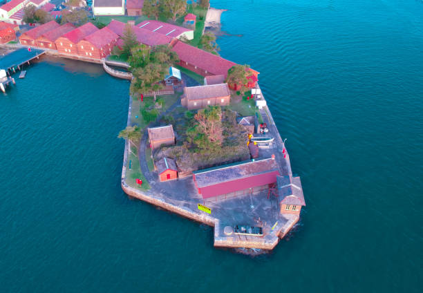 istock Panoramic drone aerial view over Sydney harbour on a cloudy sunset showing the nice colours of the harbour foreshore 1220993390