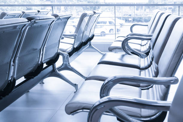istock Row of empty seats in airport lobby 1220993395