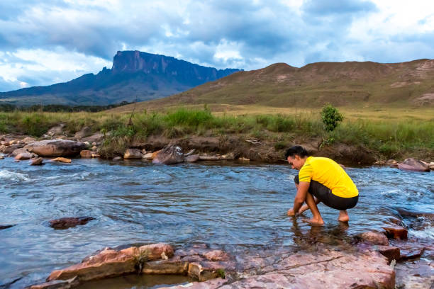 Man relaxing in nature. Mount Roaima, Venezuela.