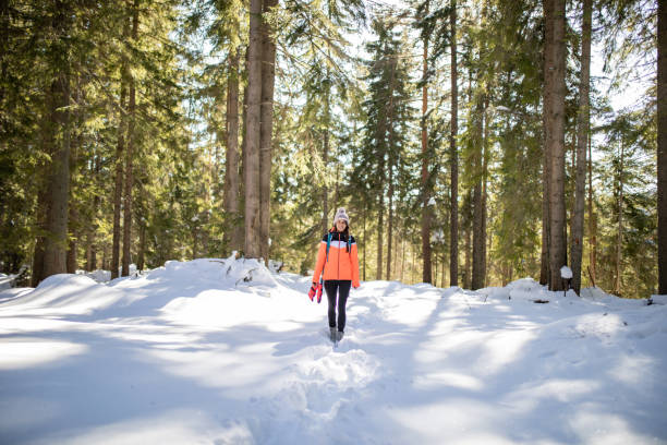 istock A young woman standing in the snow 1220996937
