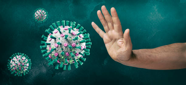 Human hand stopping COVID-19 Coronavirus