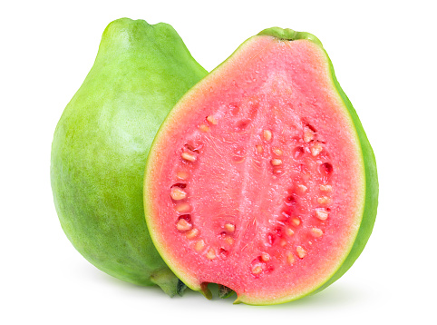 Isolated green guava. One whole guava fruit and a pink fleshed half isolated on white background