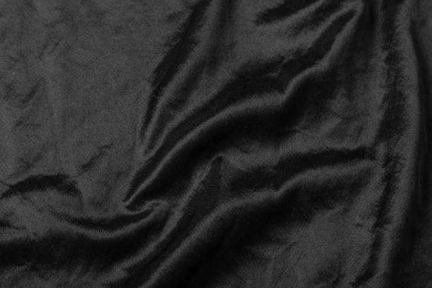 istock Abstract black fabric cloth texture background or liquid wave or wavy folds 1221000162
