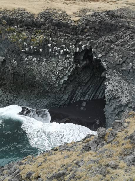 istock Big hole in the rocks at Icelandic coast at Hellnar 1221000327