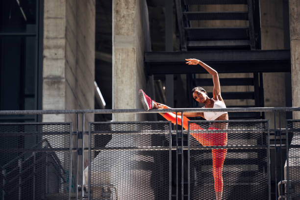 istock African Sportswoman Stretching her Leg 1221001550