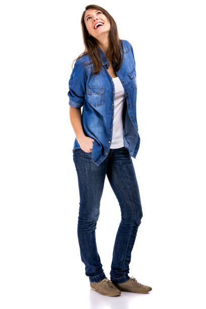 istock Beautiful woman standing over a white background with hands on the pockets and smiling 1221001908