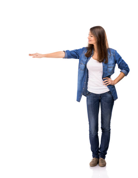 istock Beautiful woman standing over a white background with copyspace for the designer 1221001912