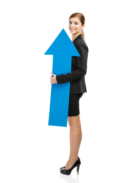 istock Business woman holding a blue arrow 1221002518