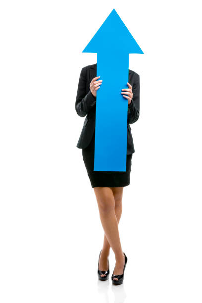 istock Business woman holding a blue arrow 1221002527
