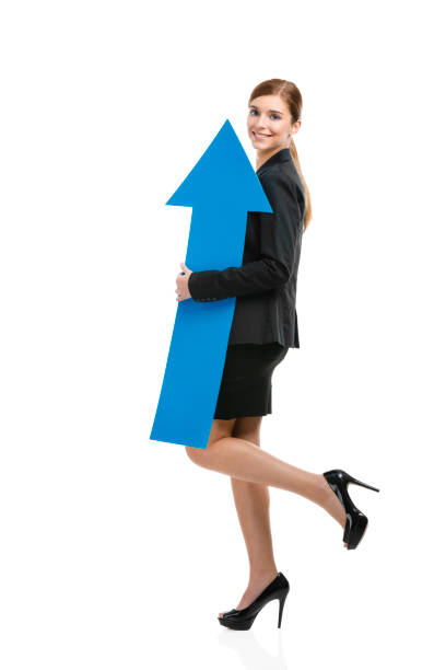 istock Business woman holding a blue arrow 1221002528