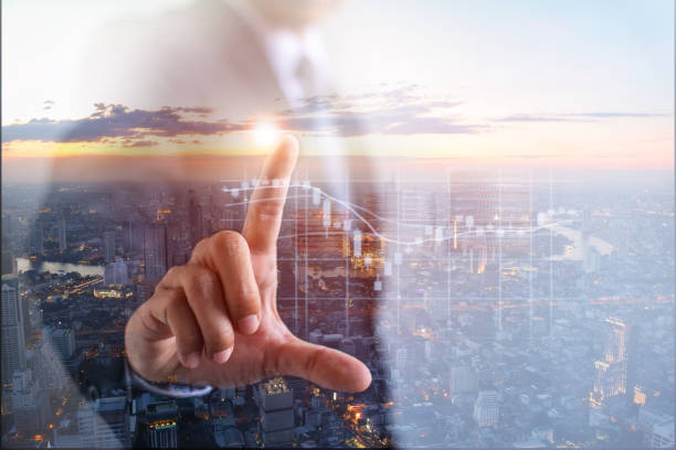 double exposure,business man pointing finger financial symbol dollar graph showing arrows pointing to financial success on city scape background. - double exposure imagens e fotografias de stock