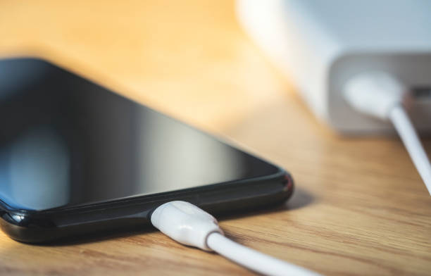 istock Charging smart phone with power bank 1221003562