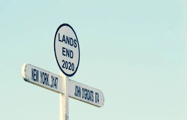 Photo of Signpost at Land`s End Cornwall UK. Land's End to John o' Groats is the traversal of the whole length of the Great Britain between two extremities (southwest & northeast). Cyclists & runners.