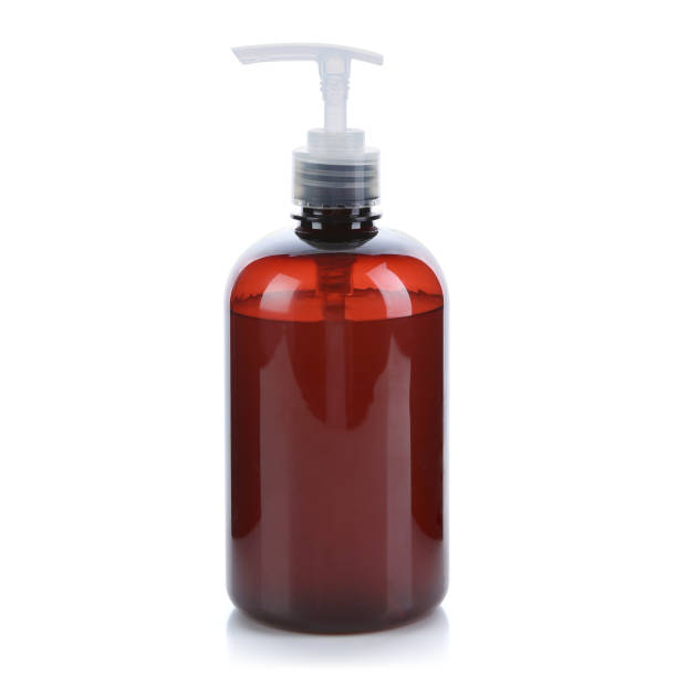 istock Amber bottle with transparent cap filled with water isolated on white background. Front view. 1221003651