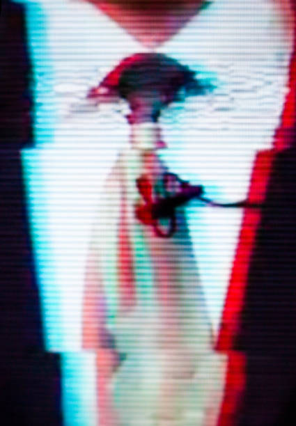 Man in a suit and a tie on the screen. Glitch.