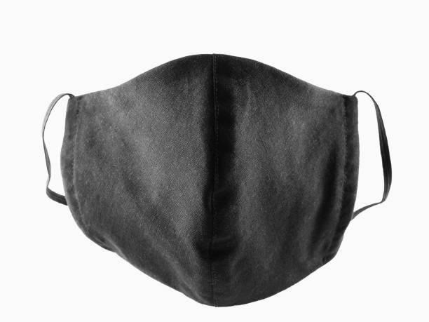 istock Protective mask isolated on white background. Face antivirus mask made from cotton. Black face mask during a pandemic virus COVID-19. Isolate 1221009668